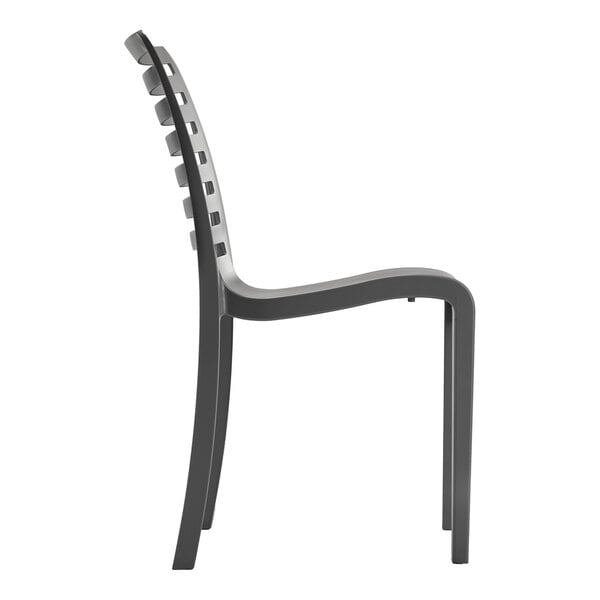 A charcoal-colored resin stackable outdoor side chair with a slatted back design.