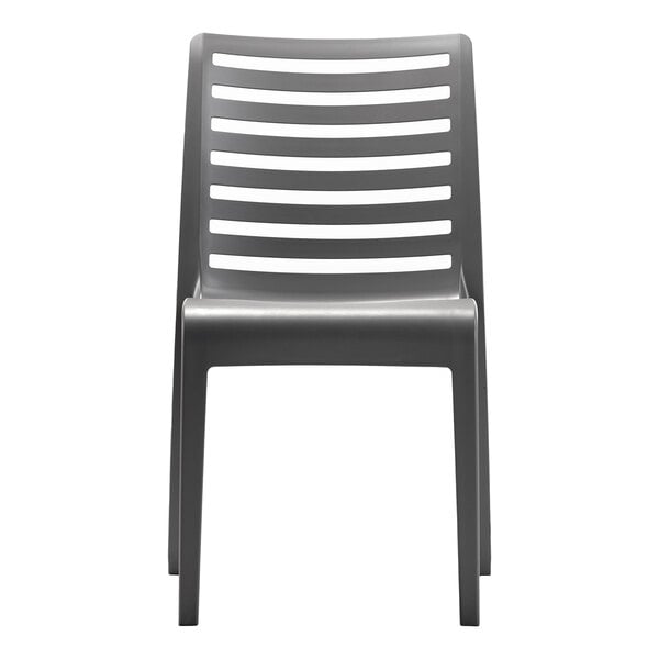 A charcoal-colored resin stackable outdoor side chair with a slatted back design.