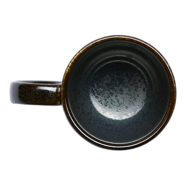 A black porcelain coupe mug viewed from above.