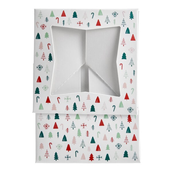 A white bakery box with a modern Christmas print and a star-shaped window on the lid.