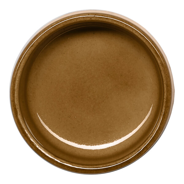 A small round brown porcelain ramekin.