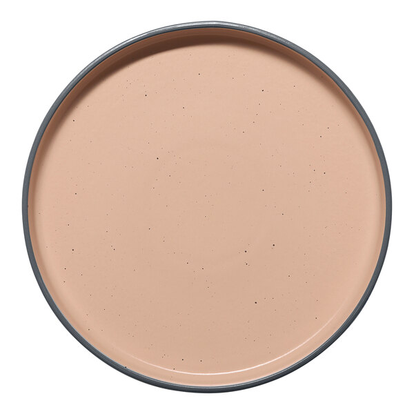 A round tan porcelain plate with a raised rim.