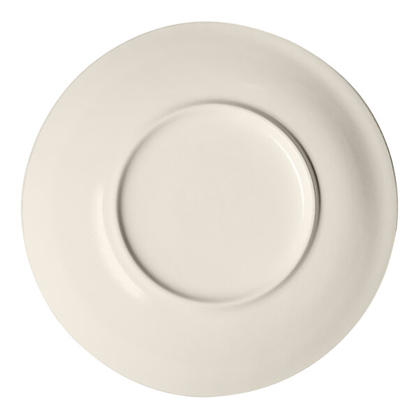 A round porcelain deep coupe plate in a brown and cream color.