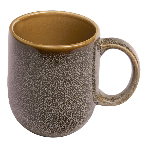 A brown porcelain coupe mug with a speckled texture and a rounded handle.