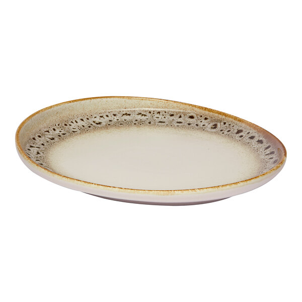 An irregular oval porcelain platter with a brown and cream spotted rim and a raised edge.