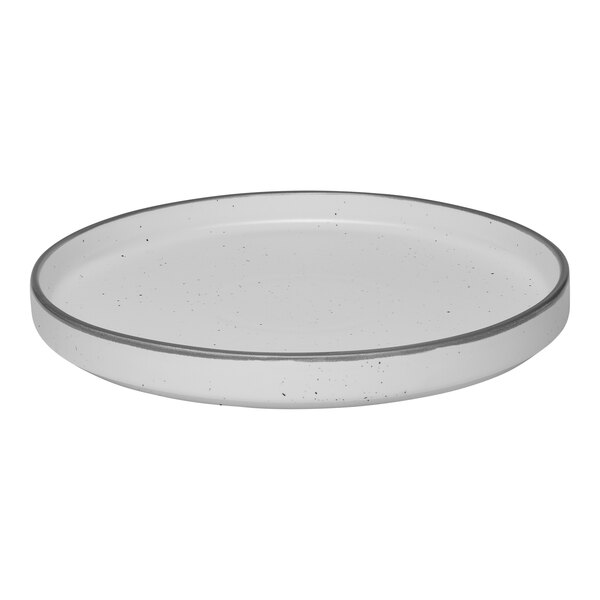 A white round porcelain plate with a raised rim and subtle speckled pattern.