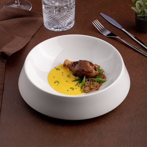 A large ivory round porcelain coupe bowl with a modern design.