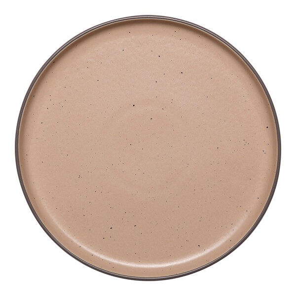 A tan round porcelain plate with a raised rim and subtle speckled pattern.