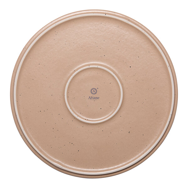 A tan round porcelain plate with a raised rim and speckled design.