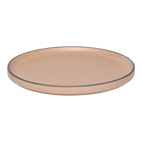 A tan round porcelain plate with a raised rim.