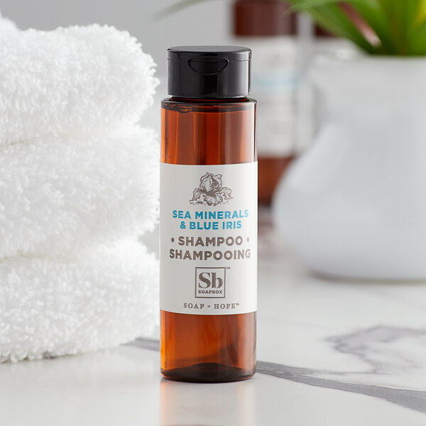 A small bottle of Soapbox Sea Minerals and Blue Iris shampoo.