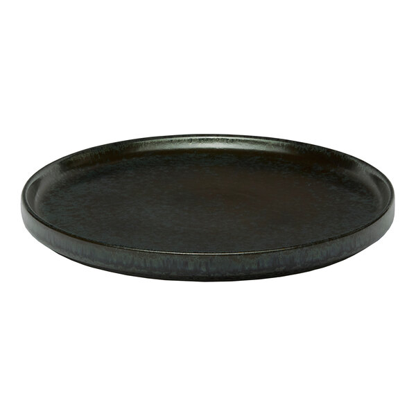 A black round porcelain plate with a raised rim.