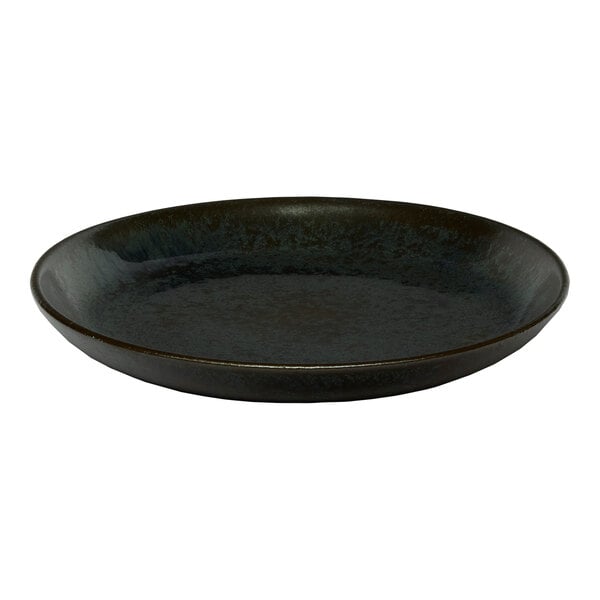 A black round porcelain coupe flat plate.