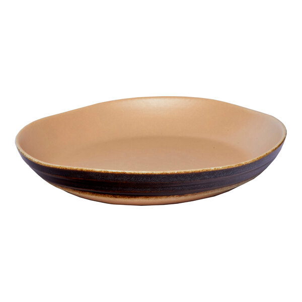 A brown round irregular porcelain bowl with a matte finish.