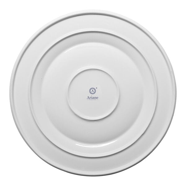 A round ivory porcelain plate with a wide rim, viewed from above.