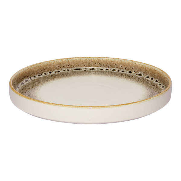 A round porcelain plate with a raised rim, featuring a brown and cream color scheme and a spotted rim design.