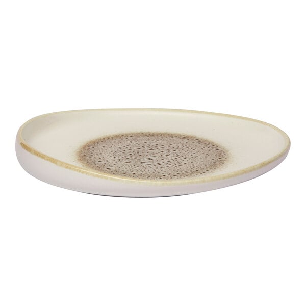 An irregular oval porcelain platter with a raised rim, featuring a brown and cream color pattern.