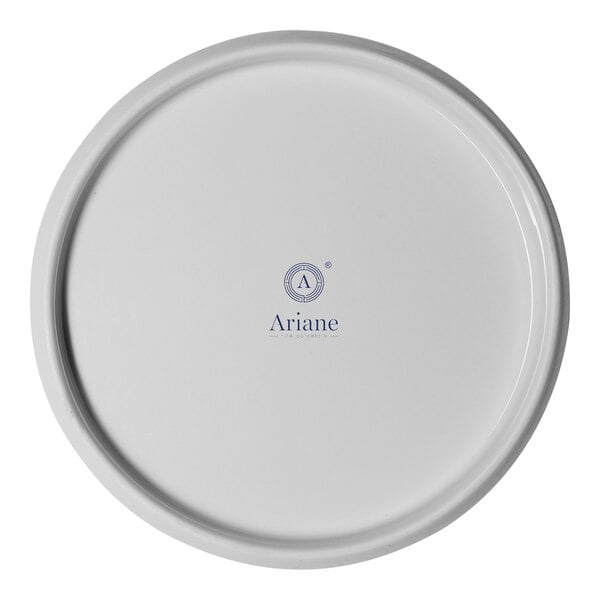 A round ivory porcelain plate with the Ariane logo in the center.