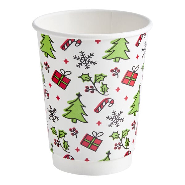 A 12 oz. double wall paper hot cup with a Christmas-themed print featuring trees, presents, holly, candy canes, and snowflakes.