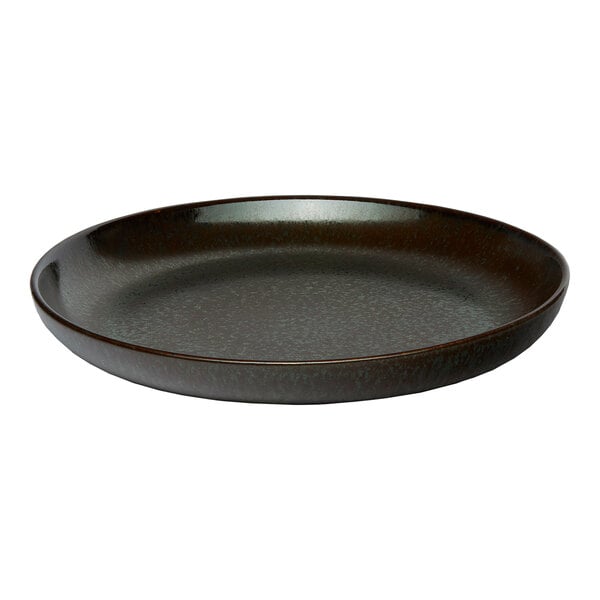 A black round porcelain coupe flat plate.