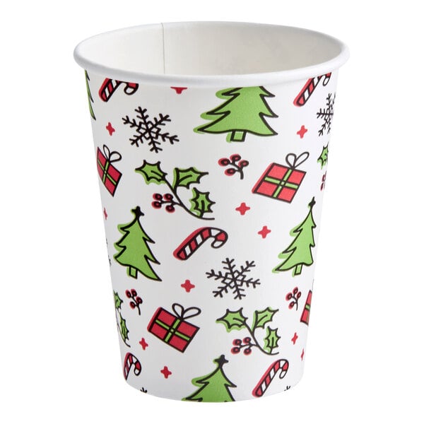 A 12 oz. paper hot cup with a Christmas-themed print featuring trees, presents, holly, candy canes, and snowflakes.