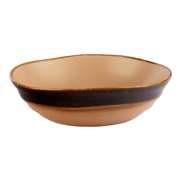 A brown round porcelain bowl with an irregular shape.