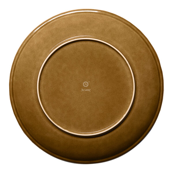 A brown round rimless porcelain coupe plate.