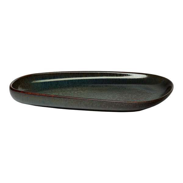 An oval asymmetric black porcelain coupe platter.