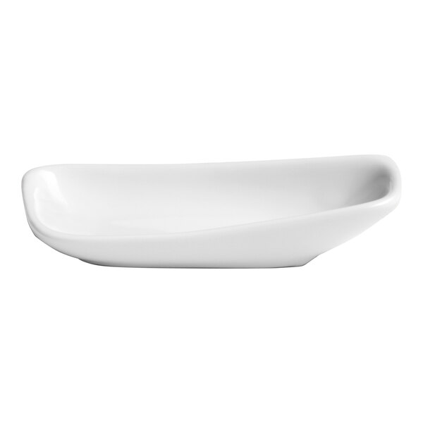 An ivory asymmetric rectangular porcelain plate with a raised rim.