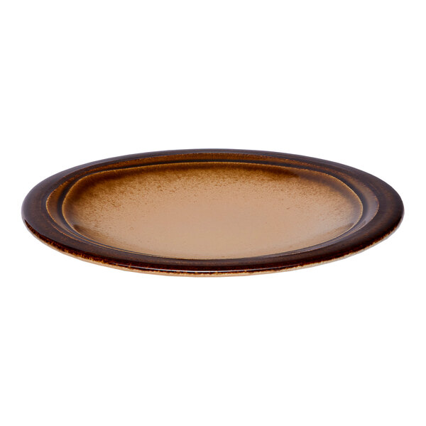 A round brown porcelain plate with a wide rim.