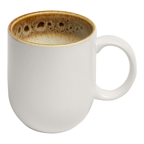 A brown and cream porcelain mug with a rounded shape and a handle.