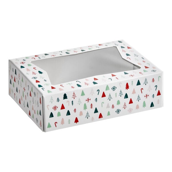 A rectangular bakery box with a clear window on top and a modern Christmas print featuring trees, candy canes, and snowflakes.