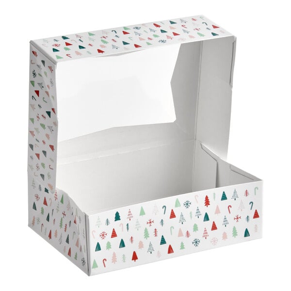 A rectangular bakery box with a clear window and a modern Christmas print featuring trees, snowflakes, and candy canes.