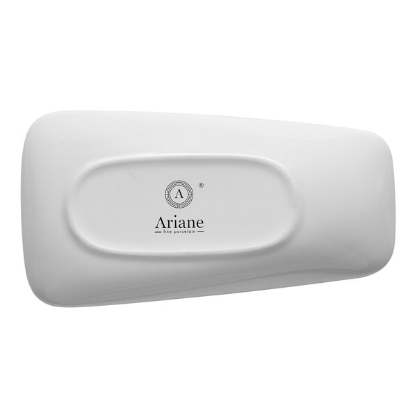 A white, asymmetric rectangular porcelain plate with a raised rim.