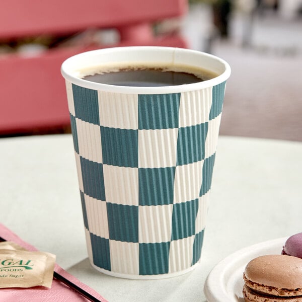 A 12 oz. double wall ripple paper hot cup with a navy checkered pattern.