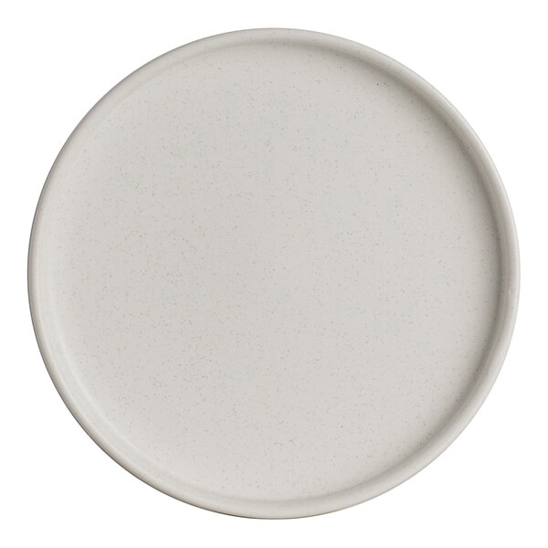 A round, light-colored porcelain stack plate with a slightly raised rim.