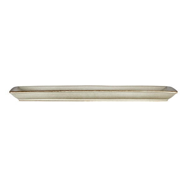 A rectangular porcelain serving tray with a slightly raised edge and a neutral glaze finish.