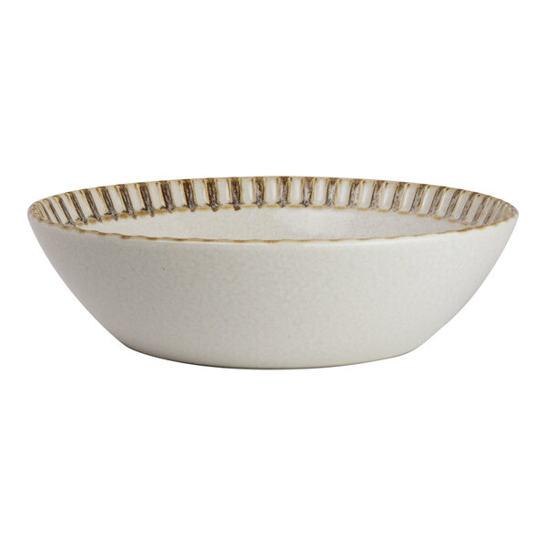 A round birch porcelain bowl with a textured rim.