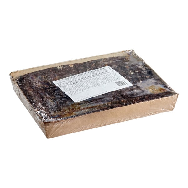 A rectangular tray of pre-cut Totally Oreo brownie bars wrapped in plastic with a label on top.