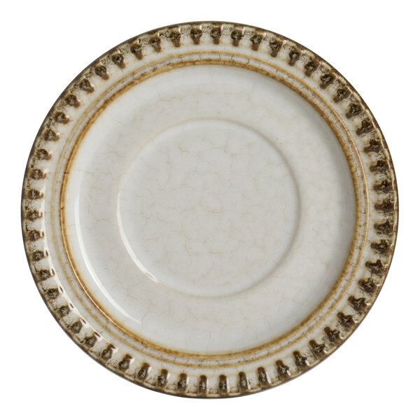 A round porcelain saucer with a textured, rustic brown and cream design.