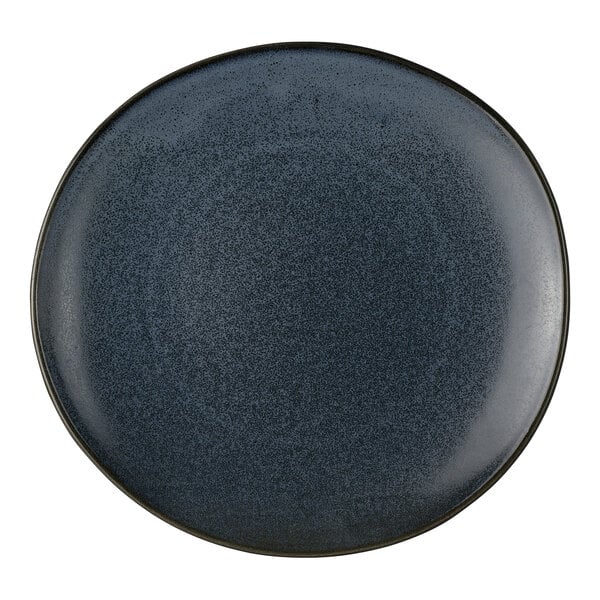 A round, dark blue porcelain coupe plate.