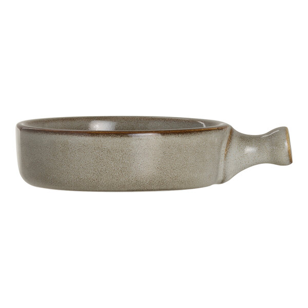 A round porcelain serving tray with a handle in a neutral glaze finish.