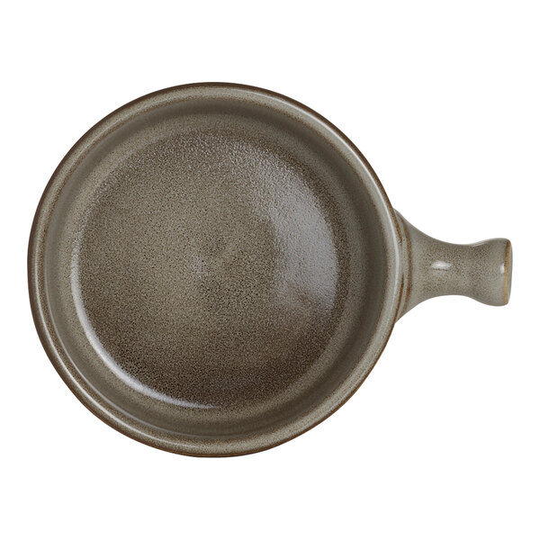 A round porcelain serving tray with a handle in a speckled gray finish.