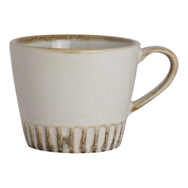 A round birch-colored porcelain coffee mug with a textured lower edge and a handle.
