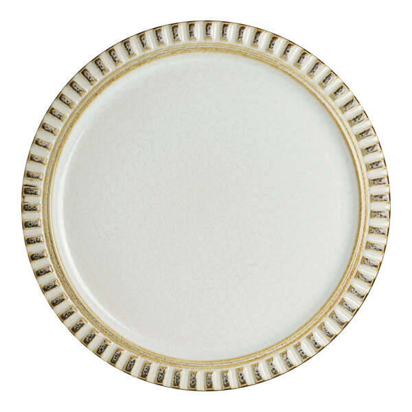An 8 1/2 inch round birch porcelain plate with a textured, patterned rim.