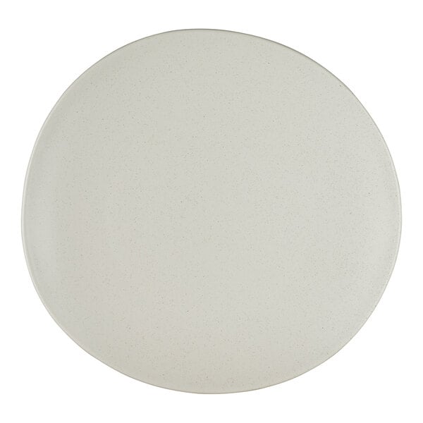 A round, off-white porcelain coupe plate with a smooth, slightly irregular edge.