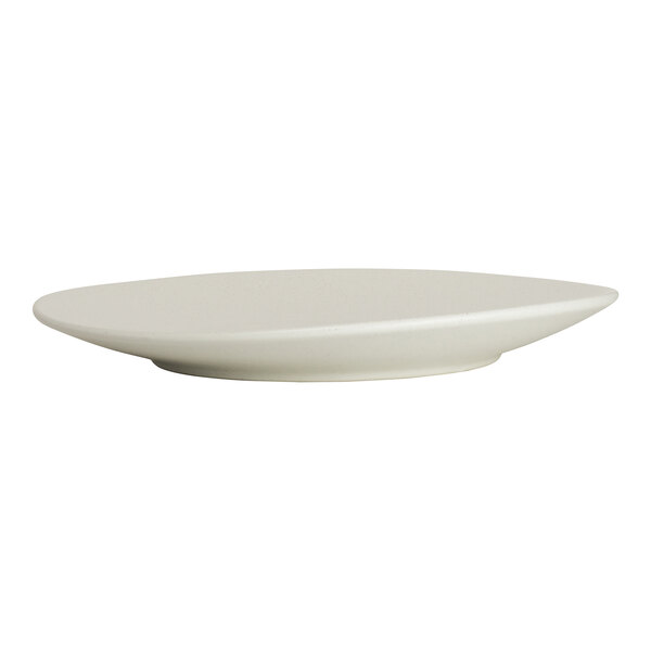 A round, white porcelain coupe plate with a slightly irregular, shell-inspired shape.