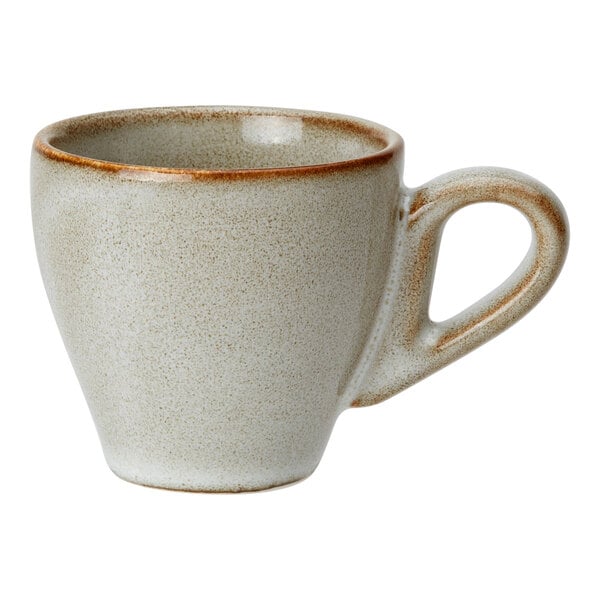 A small, beige porcelain espresso cup with a rounded handle and a slightly speckled finish.