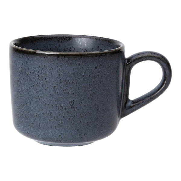 A dark blue speckled porcelain cappuccino cup with a handle.