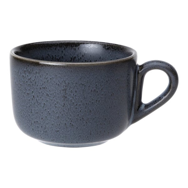 A dark blue porcelain coffee or tea cup with a speckled finish and a handle.